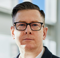 Fotografía de Alexander Hughes, CEO de una compañía de trading de criptomonedas